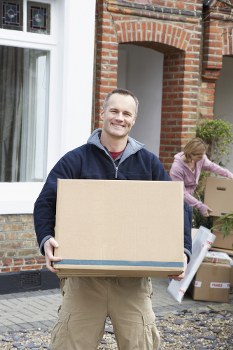 Removal team preparing belongings with safety checks and protective handling measures