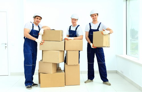Staff following safe handling practices during a move