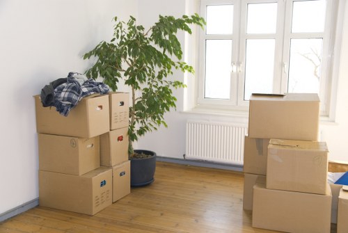 Organised home move process showing packing and room-by-room unloading in Millhill