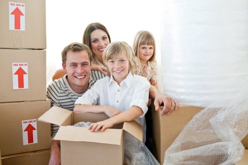 Packed moving boxes and furniture ready for transport in Millhill