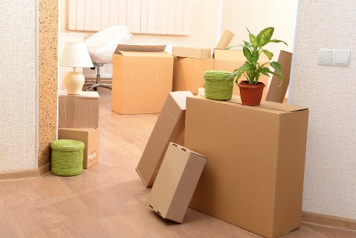 Professional movers handling a heavy item with care